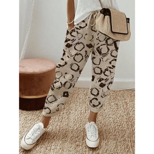 Casual cotton pants for women with breathable fabric, relaxed fit, elastic waistband, wrinkle-resistant design, and versatile style, ideal for summer days.






