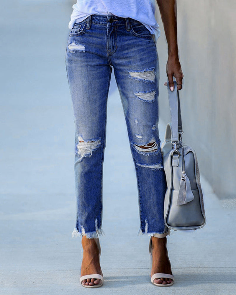 Trendy ripped jeans for women offering a casual and comfortable fit, ideal for summer days.






