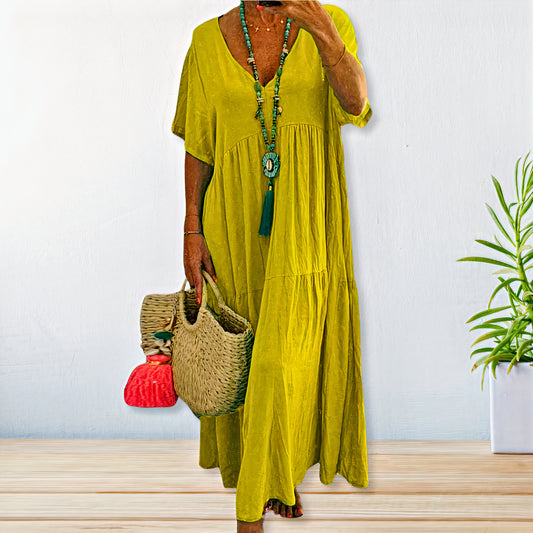 Comfy cotton-linen dress with breathable fabric, relaxed fit, and versatile design, perfect for summer days.