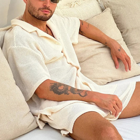 Comfy knitted two-piece set for men, featuring soft breathable material and a stylish design, perfect for summer days.






