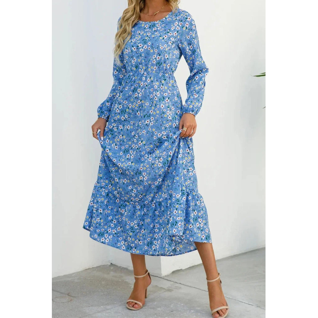 Elegant floral dress with a flattering waistline, perfect for summer events and casual outings.






