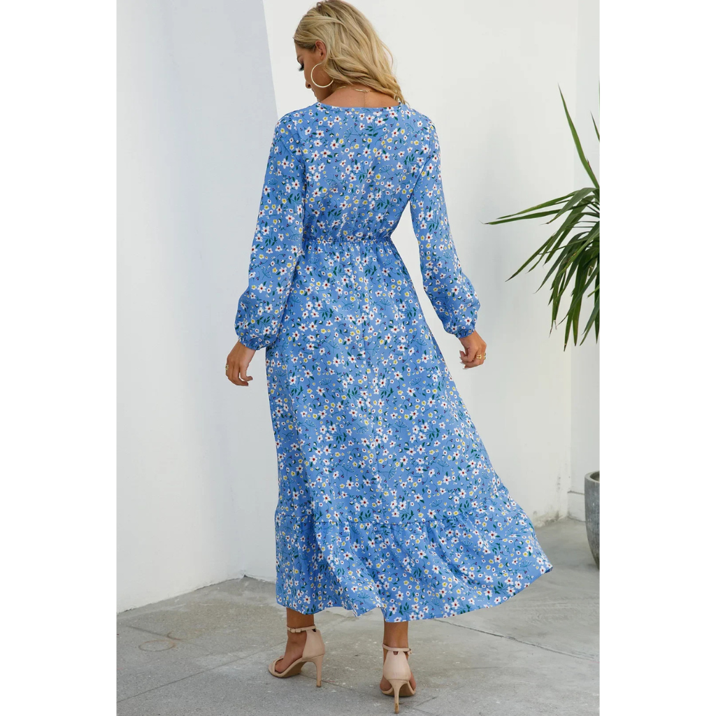 Elegant floral dress with a flattering waistline, perfect for summer events and casual outings.






