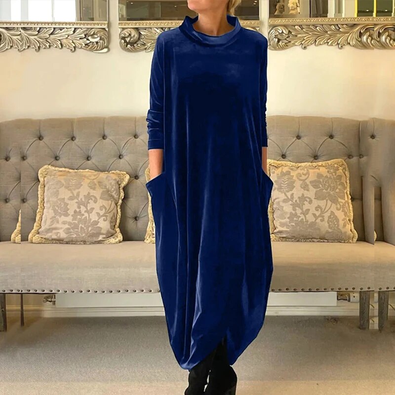 Elegant long dress with long sleeves, featuring a flowing silhouette and breathable fabric, perfect for summer days and versatile occasions.






