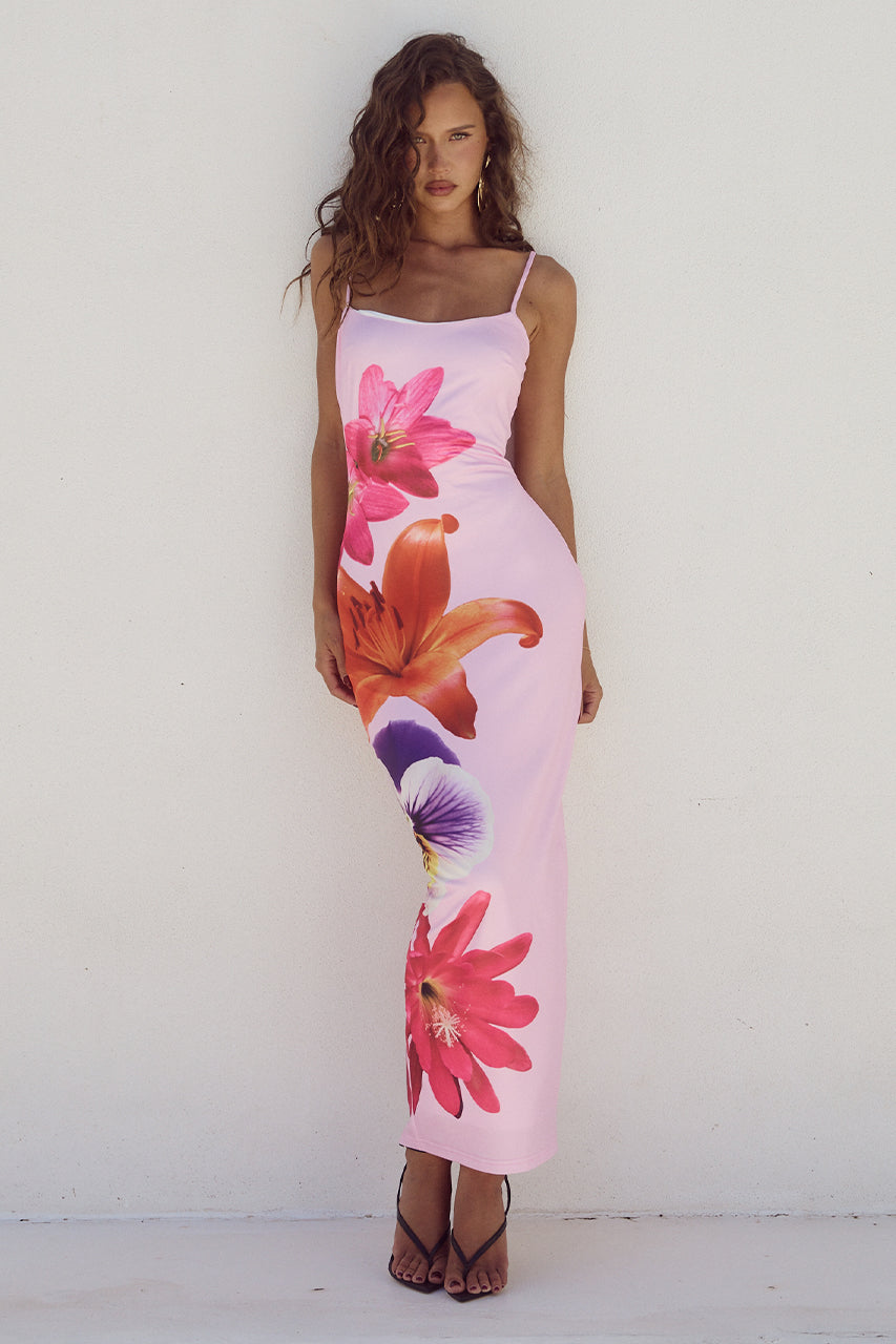 Floral long bodycon dress with a figure-hugging silhouette and elegant design, perfect for summer occasions and warm-weather events.