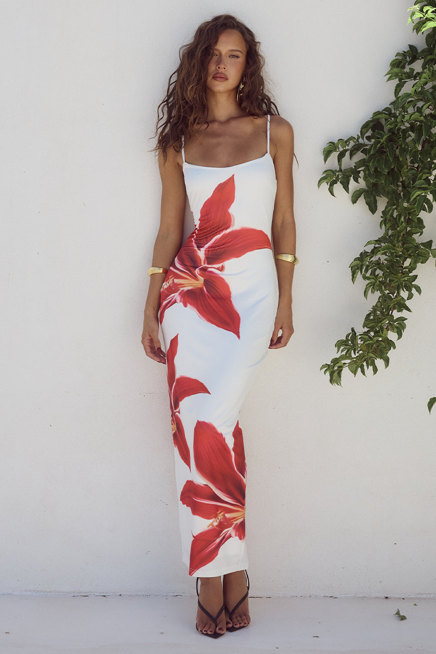 Floral long bodycon dress with a figure-hugging silhouette and elegant design, perfect for summer occasions and warm-weather events.