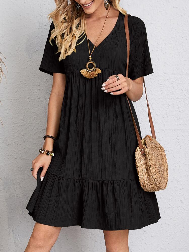 Flowy bohemian mini summer dress with a relaxed fit, perfect for warm weather and casual summer events.






