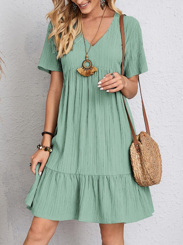 Flowy bohemian mini summer dress with a relaxed fit, perfect for warm weather and casual summer events.






