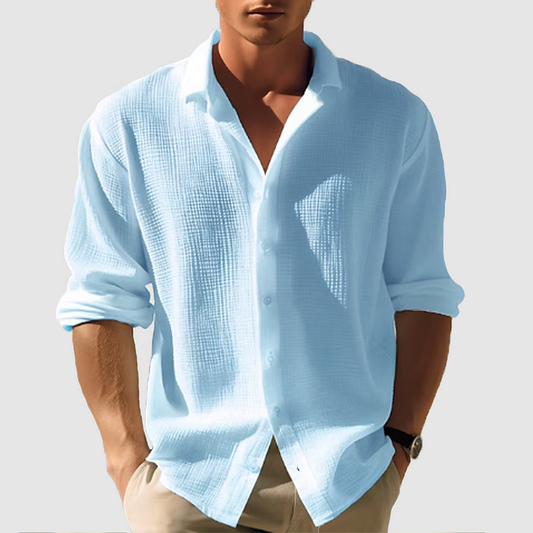 Men's long-sleeved button-down shirt, perfect for casual or formal wear during summer, offering a breathable and classic style.