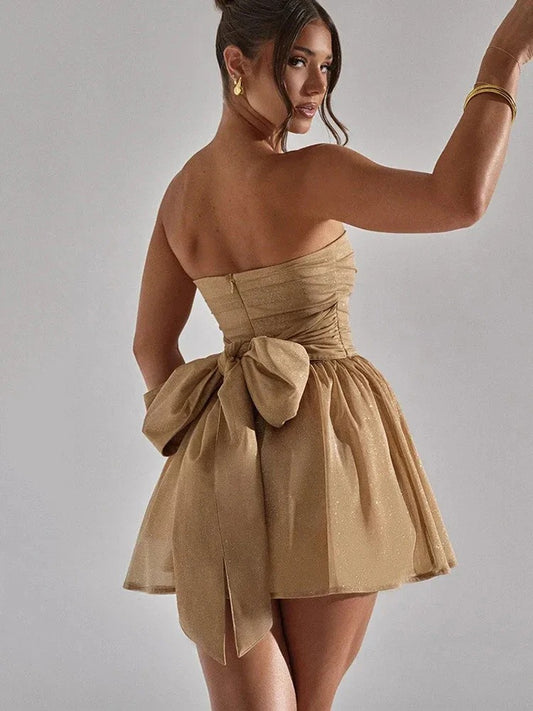 Sexy mini party dress with bow detail, perfect for summer events and confident, playful style.






