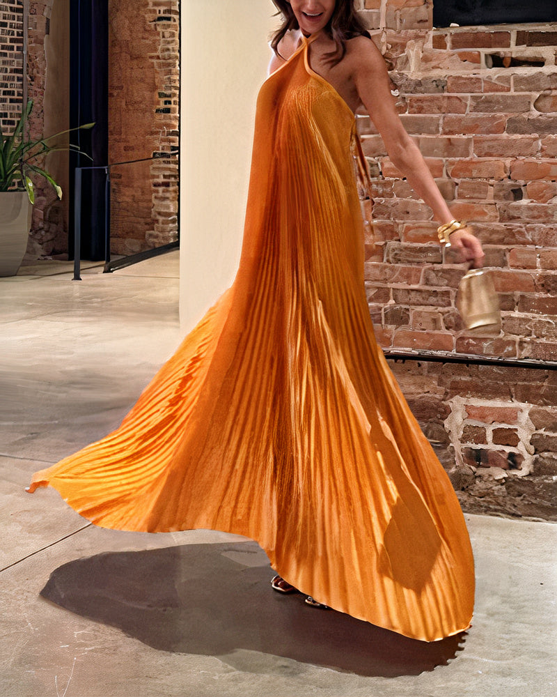 Sophisticated pleated maxi party dress with a flowing design, perfect for weddings and formal summer events.