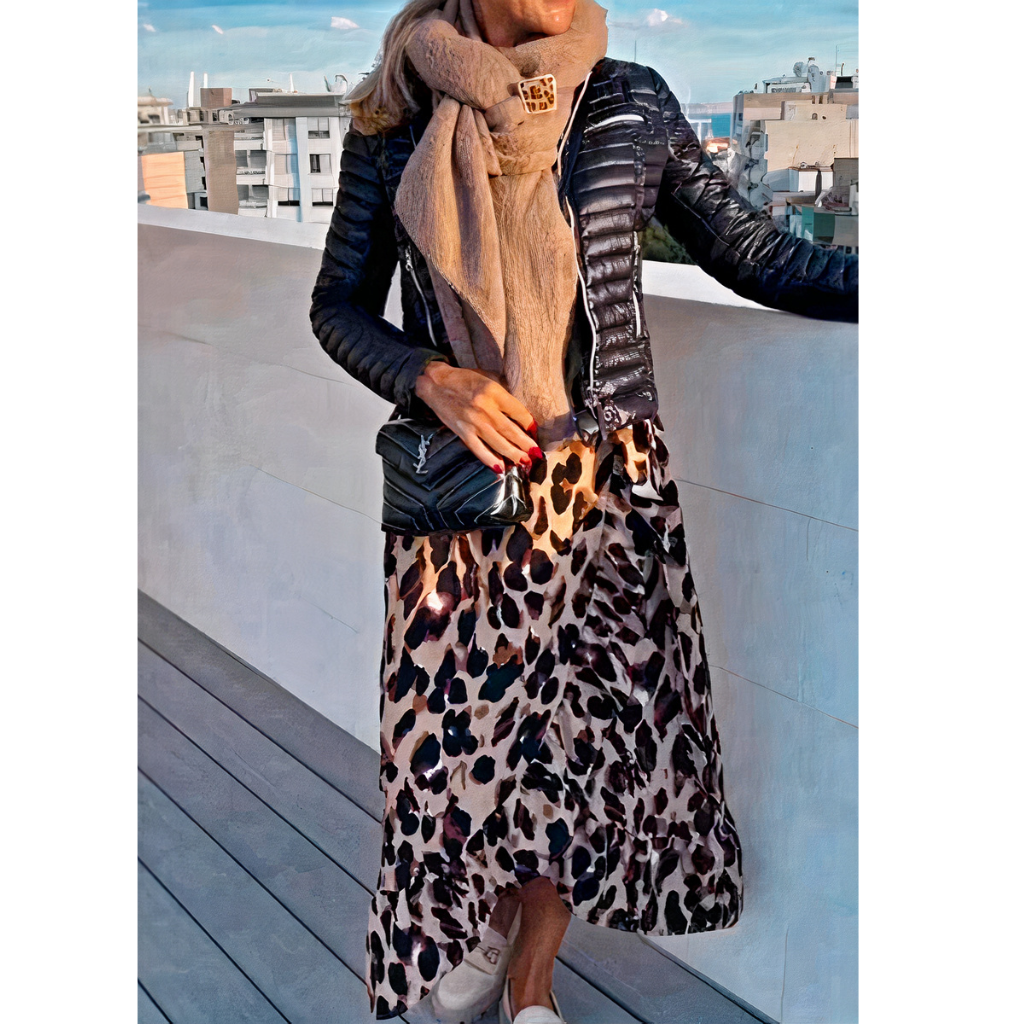 Woman wearing a stylish leopard print dress with a flowy silhouette, perfect for summer days.