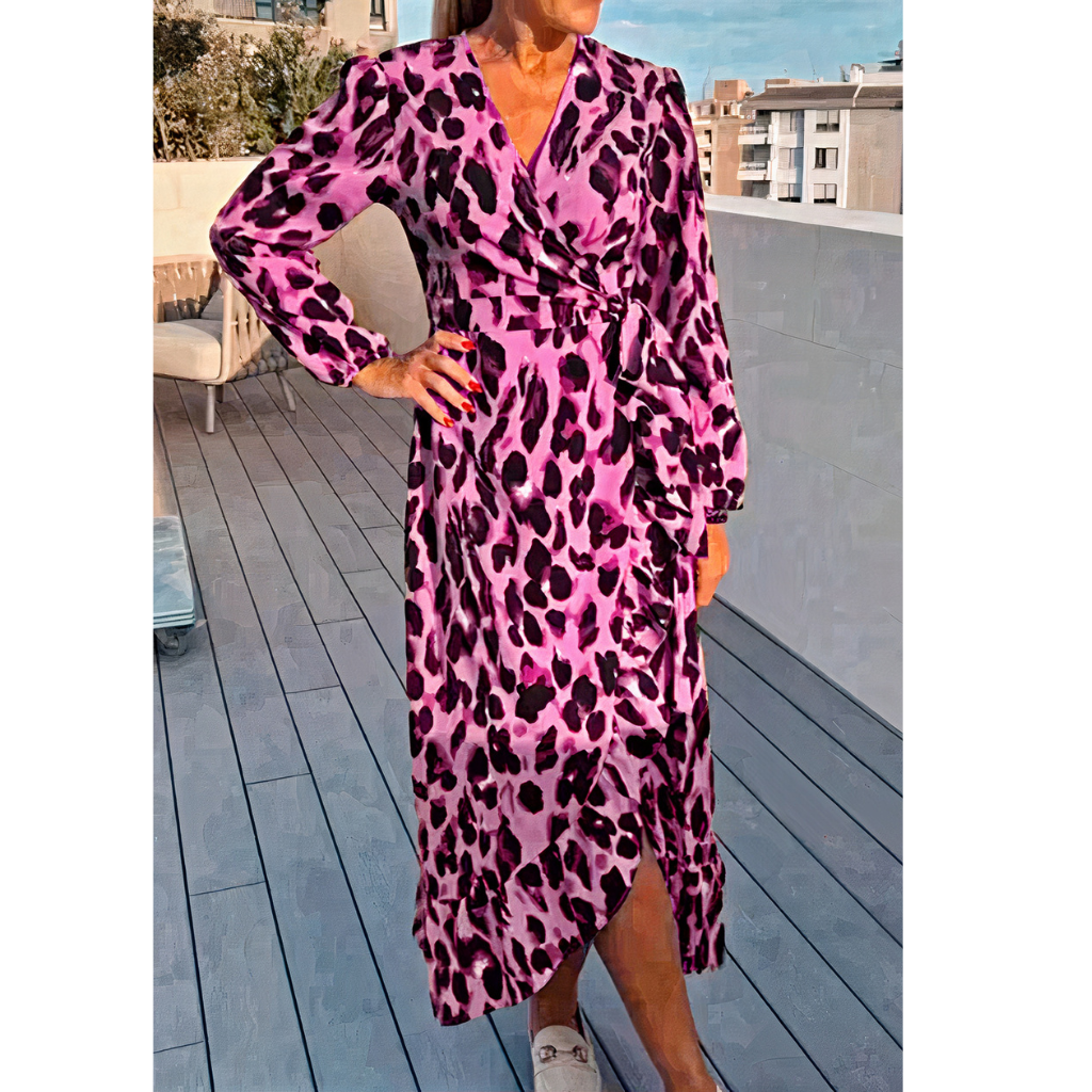 Woman wearing a stylish leopard print dress with a flowy silhouette, perfect for summer days.