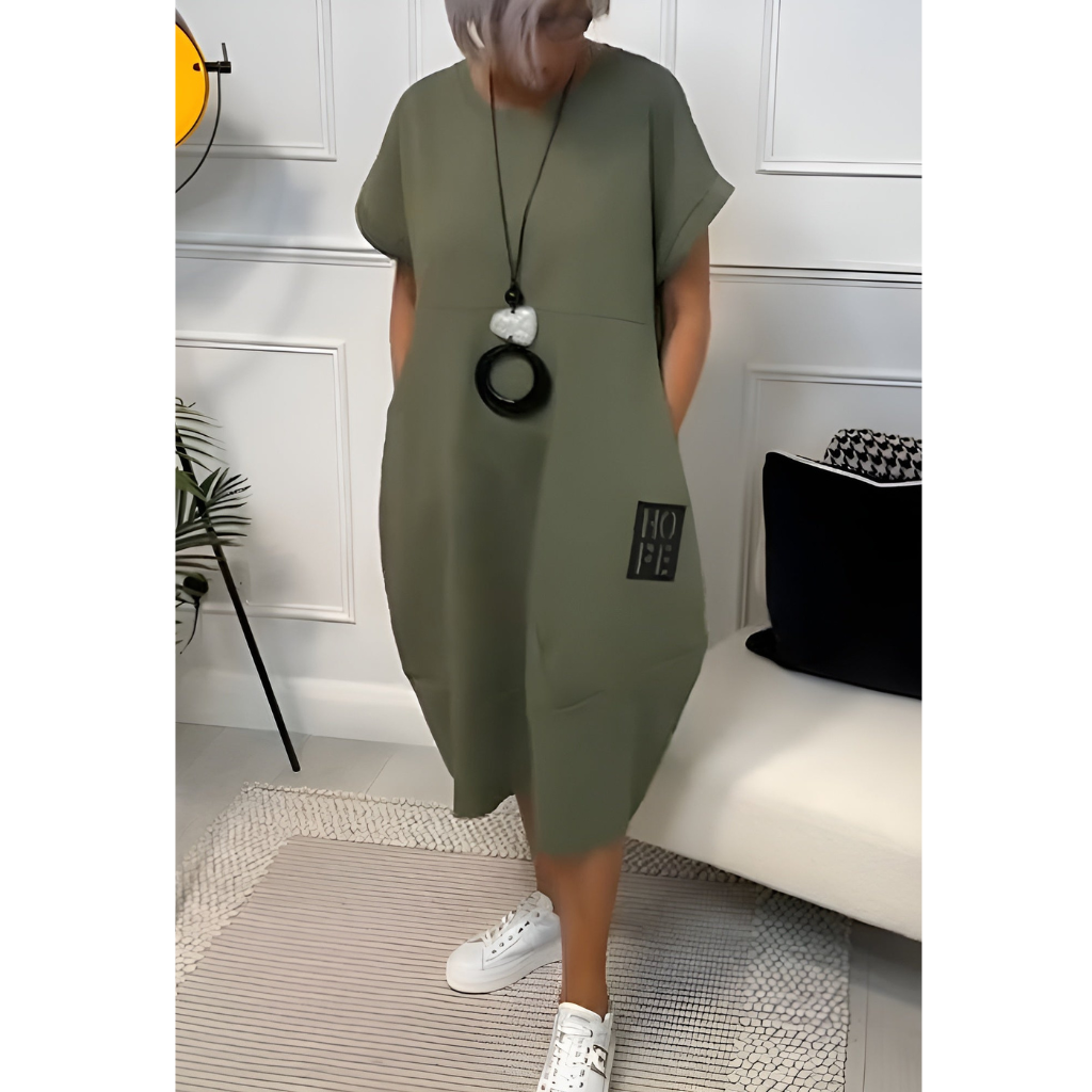 Stylish short sleeved dress made from lightweight fabric, perfect for summer days with a flattering fit and versatile design for any occasion.






