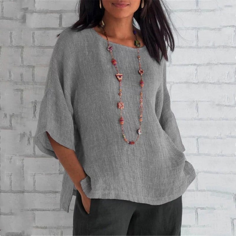 Summer linen top made from breathable fabric, ideal for warm-weather styling and versatile enough for various occasions.






