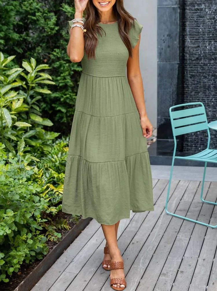 Women's elegant belly-covering summer dress with a flattering fit and breathable fabric, ideal for casual outings and special occasions on summer days.






