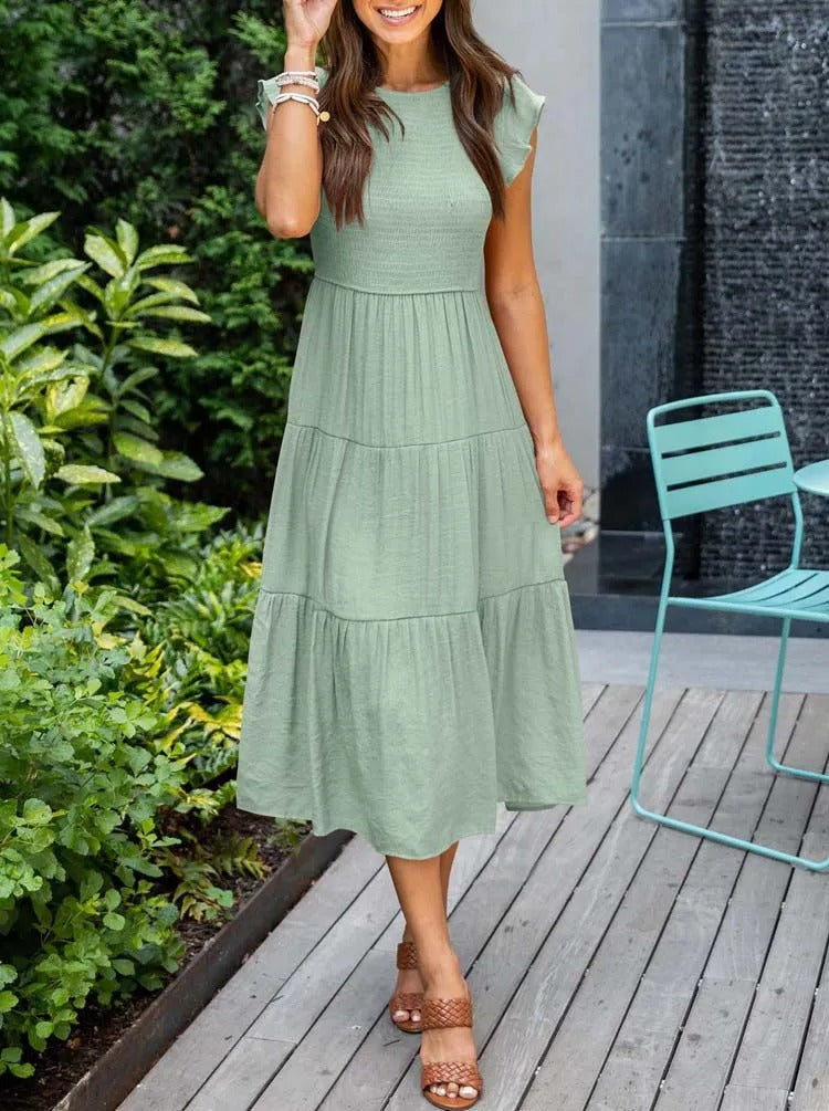 Women's elegant belly-covering summer dress with a flattering fit and breathable fabric, ideal for casual outings and special occasions on summer days.






