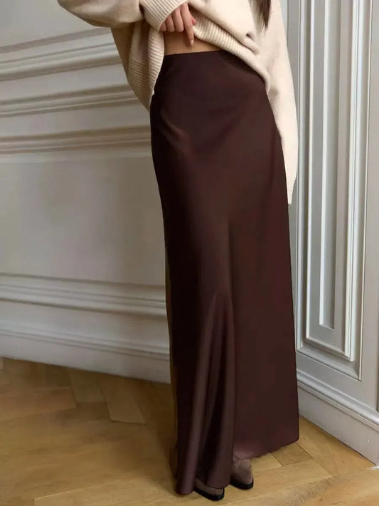 Women's elegant silk maxi skirt with a flowing silhouette, perfect for summer days and versatile styling.