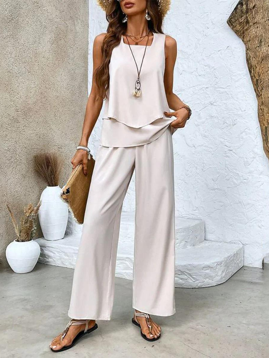 Women's sleeveless top and pants set, designed for summer comfort and style with breathable fabric and modern elegance.