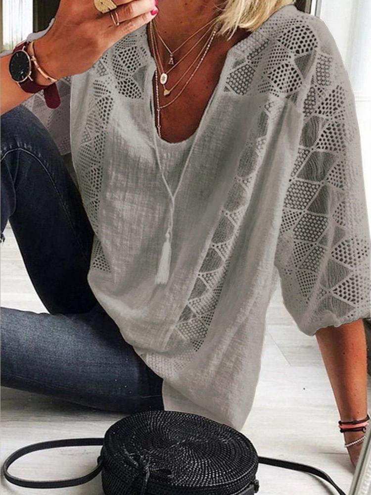 Women's summery crochet blouse, featuring breathable fabric and intricate crochet detailing, perfect for warm weather and casual occasions.