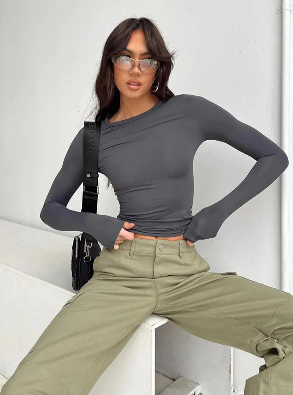 Women's trendy slim-fit long sleeve top with a flattering and comfortable design, perfect for casual or stylish summer outfits.






