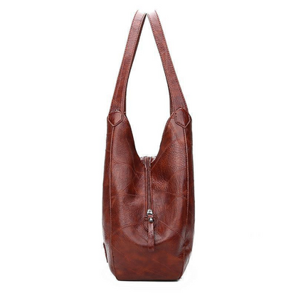 Women's Vintage Leather Bag with premium leather craftsmanship, ample storage, and a lightweight design, perfect for summer days.






