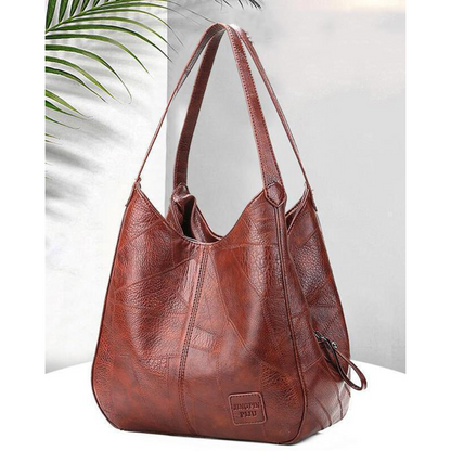 Women's Vintage Leather Bag with premium leather craftsmanship, ample storage, and a lightweight design, perfect for summer days.






