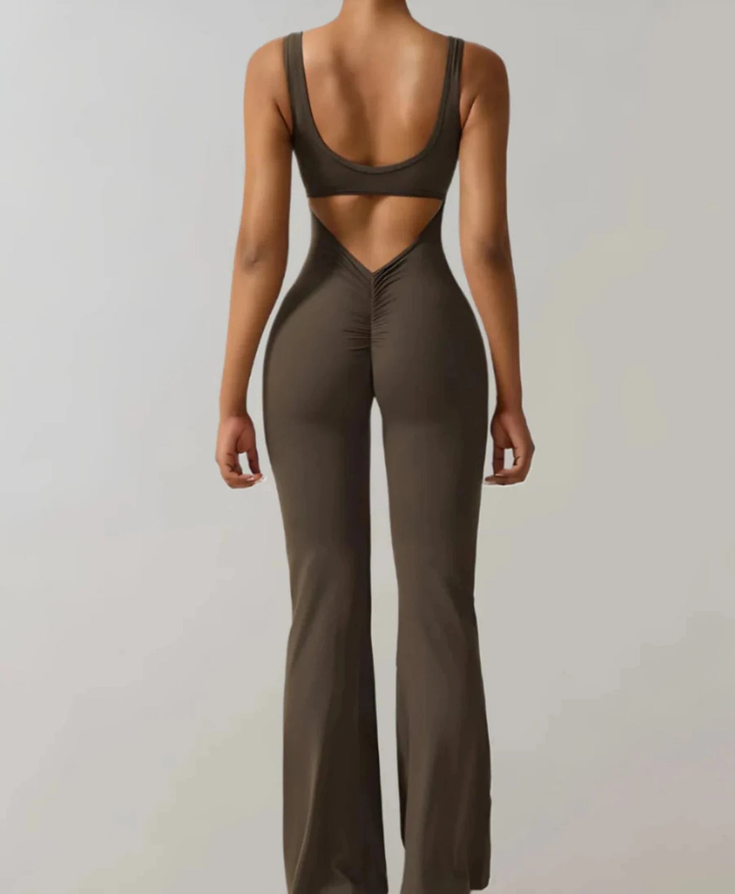 A stylish women's backless bodycon jumpsuit designed for summer wear, featuring a flattering fit and trendy design that enhances the wearer's silhouette